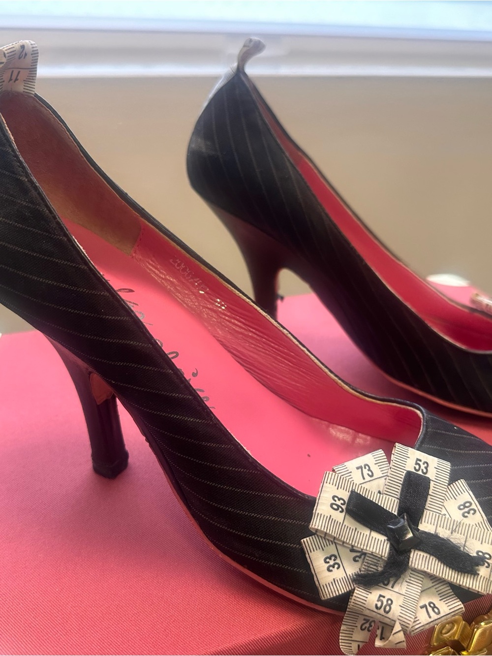 Irregular Choice Black Pinstripe Heels with Pink Lining and Measuring Tape Bow